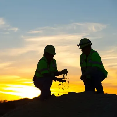 workers on a hill