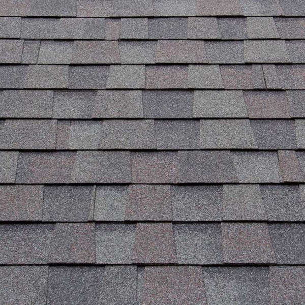 Roof shingles made using GRANSUIL for roofing granules in residential or commercial construction treated with DST dust suppression technology for safer worker environment aligned with OSHA regulations and ESG message with reduced silica dust exposure.