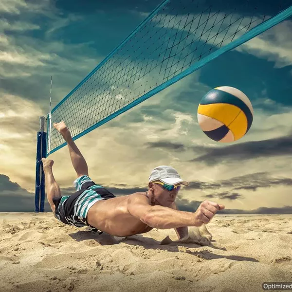 Athlete playing professional or recreational volleyball on safe, clean, angular BESTSAND VB volleyball sand to give secure footing playing surface.