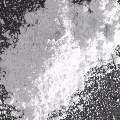 Closeup of bright white nepheline syenitre mineral HIFILL N functional mineral for plastics and elastomers.