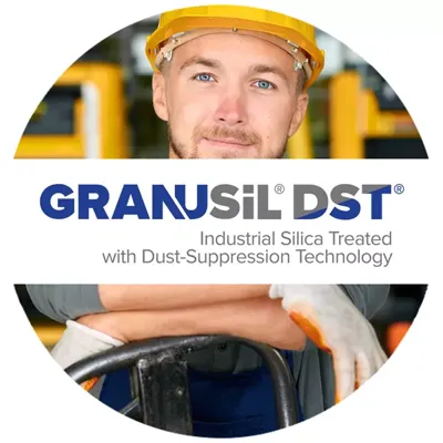 Smiling worker in safety gear that is happy to be in a safer working environment due to use of DST dust suppression technology.
