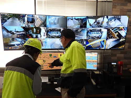 men looking at screens