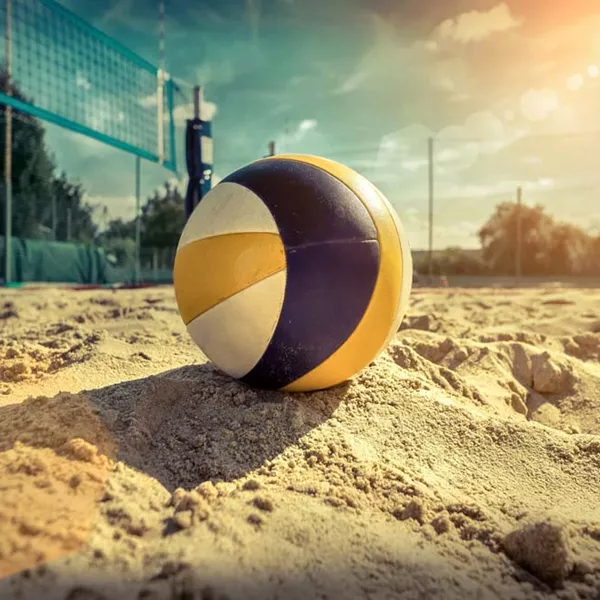 Dramatic shot of volleyball in sand arena using high performance BESTSAND sports sand.