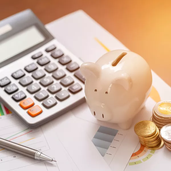 calculator and a piggy bank