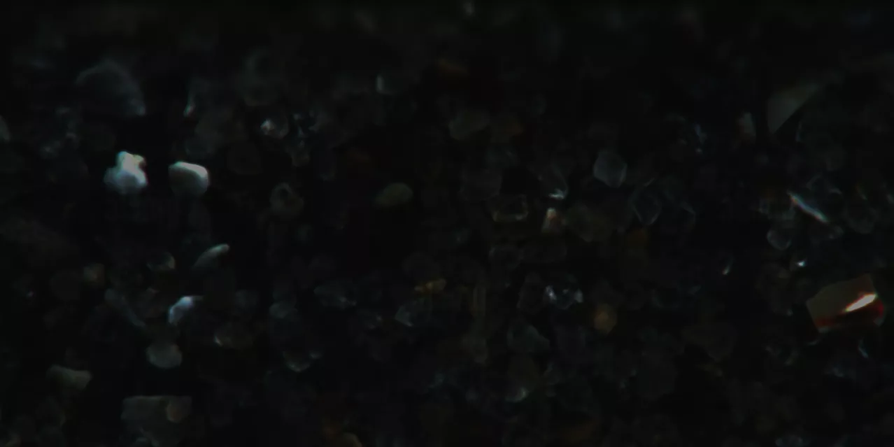 Close Up Of Sea Sand Grains Containing Shell Fragments Silica