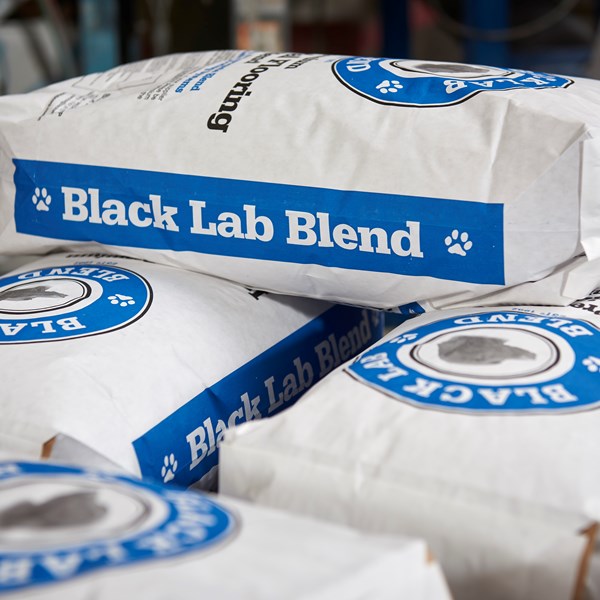 Industrial bags of BLACK LAB BLEND premium aggregate to enhance epoxy flooring durability and reduce the amount of resin and hardener needed during installation, incorporating our DST dust suppression technology that reduces dust in the working environment making it safer for workers and the environment.