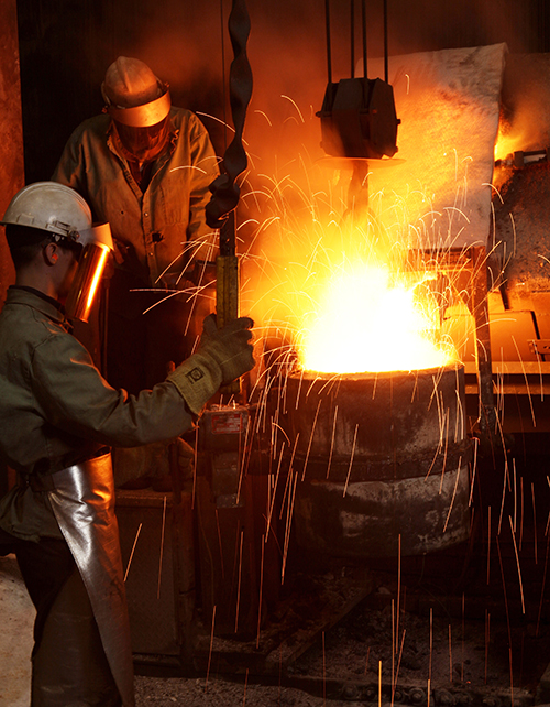 men working in metals foundry
