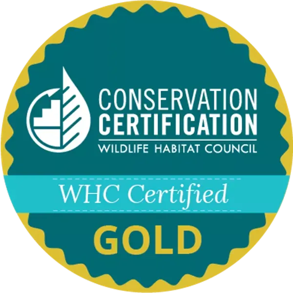 WHC certified gold logo from the Wildlife Habitat Council showcasing Covia's conservation certification we have had since 1996 displaying how Covia shows an extensive social responsibility commitment to our team, customers, communities, and planet and our devotion to sustainable mining. 