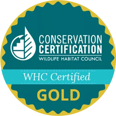 WHC certified gold logo from the Wildlife Habitat Council showcasing Covia's conservation certification we have had since 1996 displaying how Covia shows an extensive social responsibility commitment to our team, customers, communities, and planet and our devotion to sustainable mining.