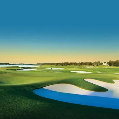 Vibrant landscape of a golf course with bright white angular bunker sand for stable ball support and great playability.