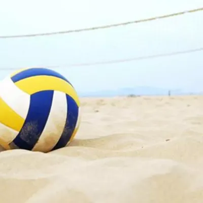Sports volley ball on well draining off white BESTSAND volley ball sand with consistent texture, less glare, and no crusting.